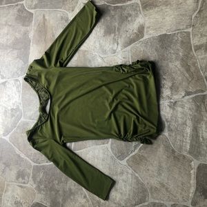 A green No Boundaries shirt